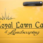 A logo for Royal Lawn Care on the side of a truck