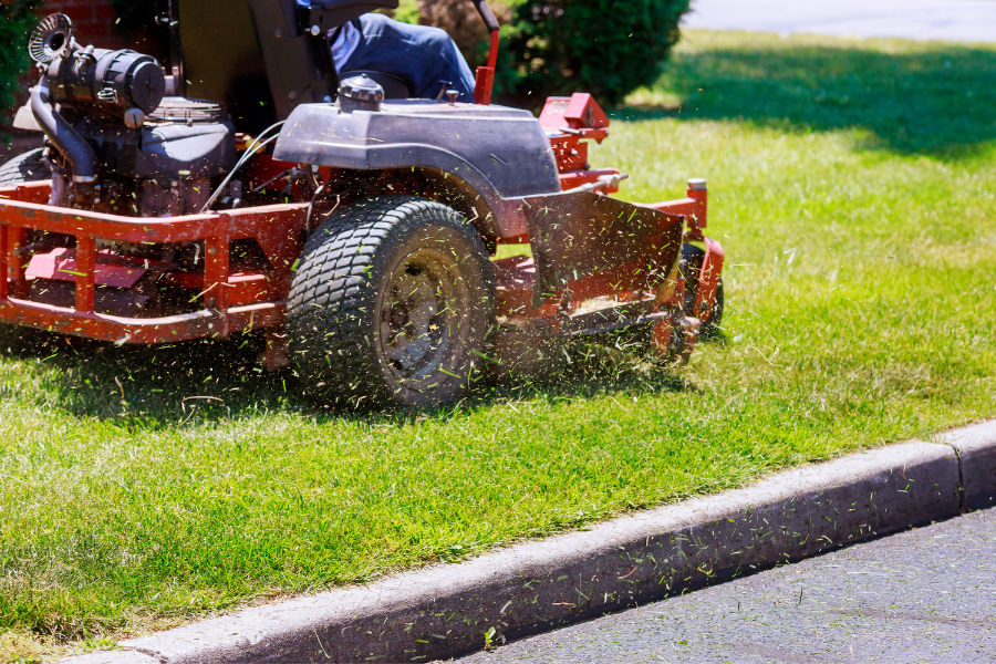 Closeup of a lawn mower cutting grass