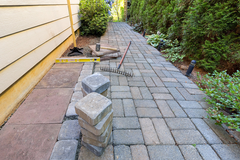 Bricks being laid down on a path
