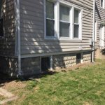 An area in front of a house with dying grass